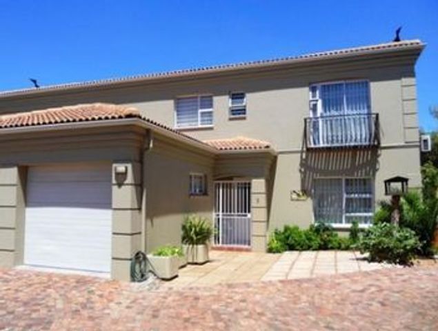 This luxury 3 bedroom townhouse in an secure estate in Strand North (close to the beach) has an open plan kitchen,granite top & cherry wood cabinets,lounge with a fire-place.It is selling for R1.75m