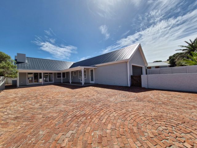 Brand new lock up and go house for sale in De Kelders.
