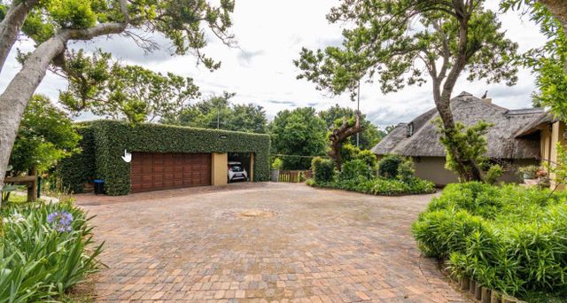 Beautiful thatch property, on the river with beautiful bush
