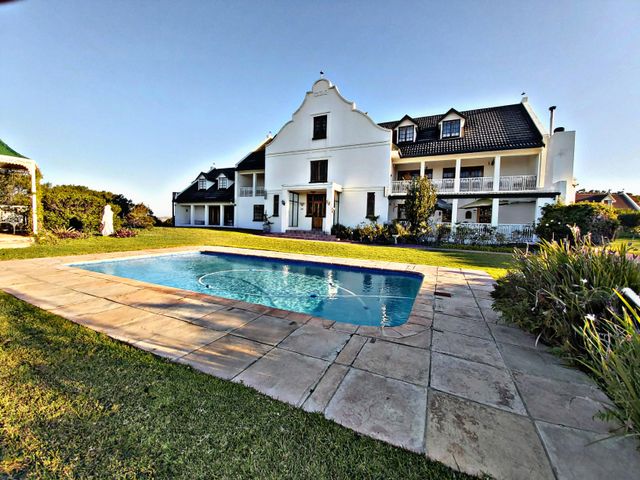 Live in luxury on this beautiful Cape Dutch Manor styled farm, offering everything and more....