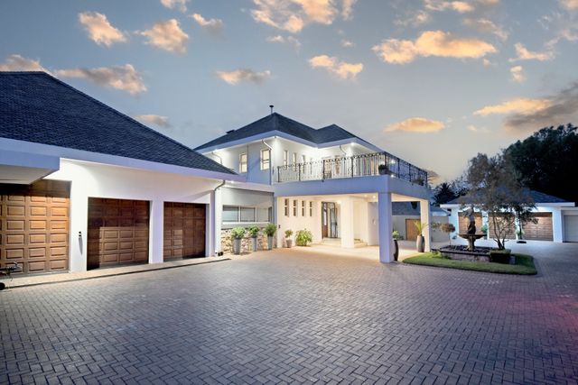 EXCLUSIVE FOUR BEDROOM FAMILY HOME WITH TEN CAR GARAGE: A DREAM HAVEN FOR CAR ENTHUSIASTS!