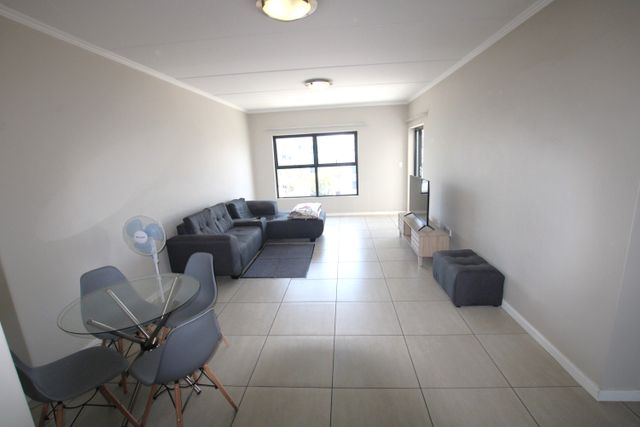 SUNNY TWO BEDROOM, TWO BATHROOM UNIT IN EXCELLENT CONDITION